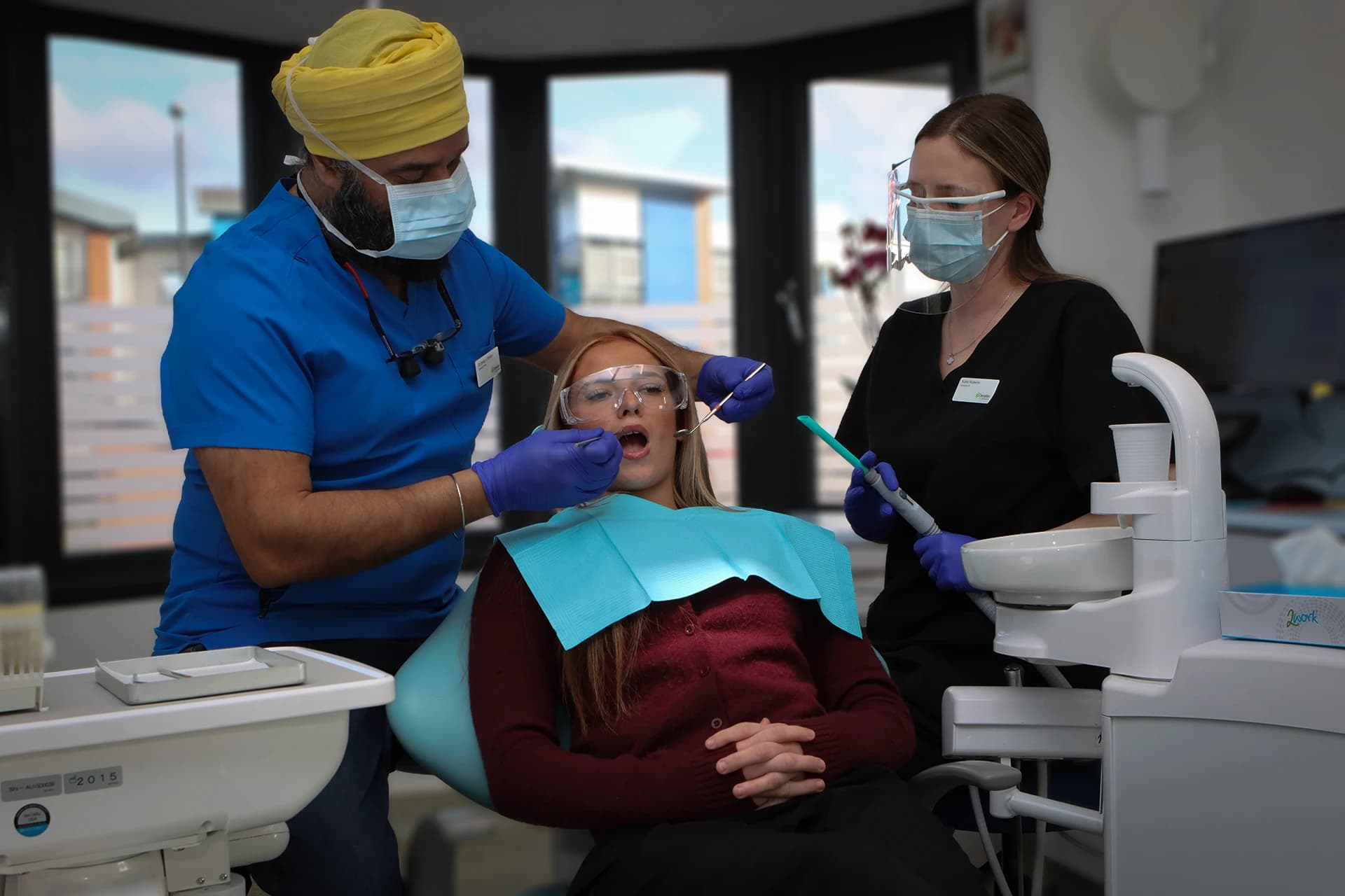 Maypole dental clinicians performing a consultation and clinical assessment for composite bonding.